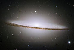 The Sombrero galaxy (M104, NGC 4594) is another example of a bulge dominated galaxy. The Sombrero contains a black hole of 1000 million solar masses as measured by Kormendy, Bender and collaborators in 1996 (Astrophysical Journal 473, L91).